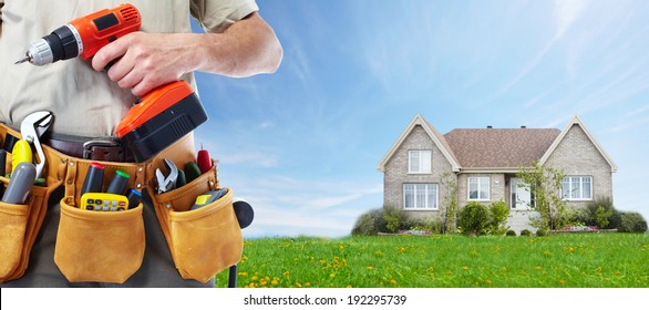 Worker with a tool belt. Construction and house renovation concept. - Powered by Shutterstock