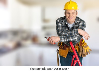 Worker with tools in empty building - Shutterstock ID 1068660257