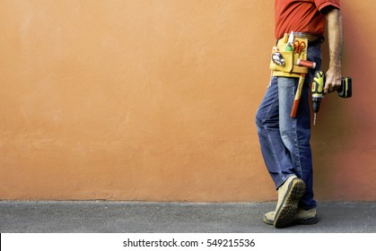 A Worker With Tools For Maintenance And Repair