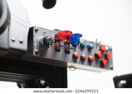 worker turning on the toggle switch up, industrial power control panel