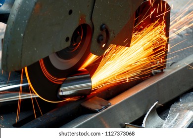 Worker Use Chop Saw to Cutting a Thick Stainless Steel Tube in a Construction Work Site. - Powered by Shutterstock