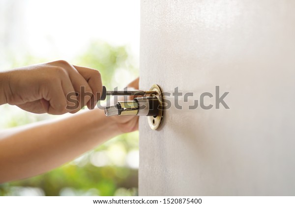 Worker Use Screwdriver Remove Installing Door Stock Photo