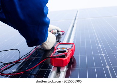 Worker used a meter for checking the readiness of the solar panel to confirming function normally before installation. Solar panels installation process.