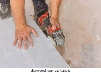 The Worker Uses The Diamond Polishing Disk From An Angle Grinder In Order To Polish The Cut Corners Of Tiles