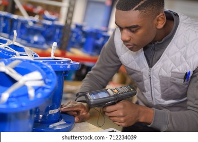 Worker Using Handheld Scanner