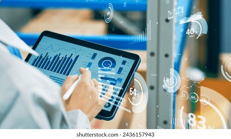 Worker using tablet PC and statistical data. Inventory control. Warehouse management systems. - Powered by Shutterstock