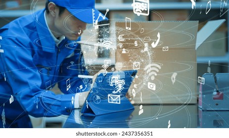 Worker using a tablet in a warehouse and communication network concept. IIoT. Industrial Internet of Things.