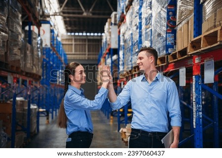 Worker in the warehouse checking the stock is on the shelves at the manufacturing. Engineer is working in the warehouse.