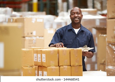 Worker In Warehouse Preparing Goods For Dispatch - Powered by Shutterstock