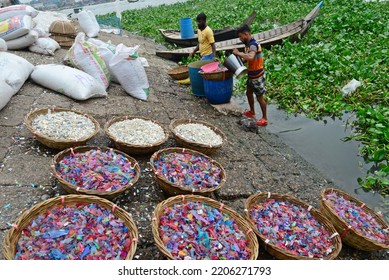 
Worker Washes Recycled Plastic Chips In The River Buriganga In Dhaka, Bangladesh, On September 25, 2022. 