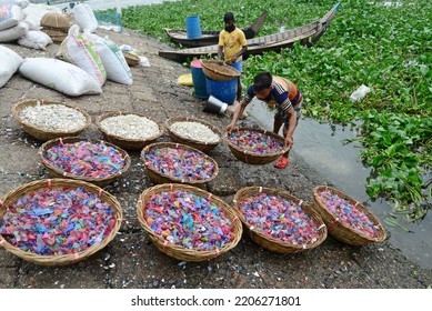 
Worker Washes Recycled Plastic Chips In The River Buriganga In Dhaka, Bangladesh, On September 25, 2022. 