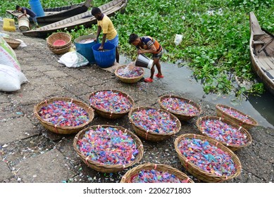 
Worker Washes Recycled Plastic Chips In The River Buriganga In Dhaka, Bangladesh, On September 25, 2022. 