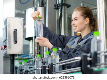 Worker At A Water Factory