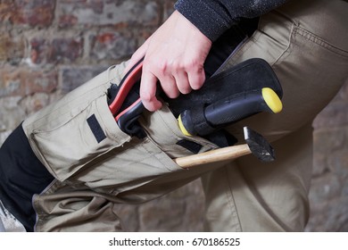 Worker Wearing Work Pants With Tools In Pockets