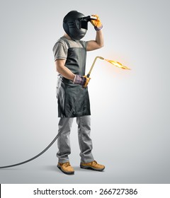 worker welder in a protective mask with gas welding machine on isolated background