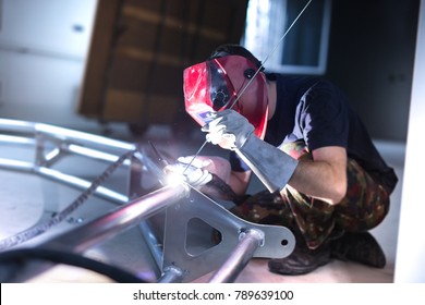 Worker Welding Aluminum Truss Using Tig Welder