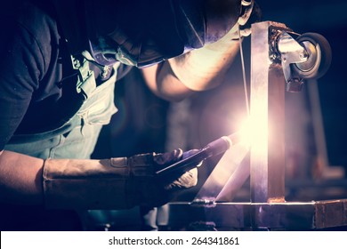 Worker Welding Aluminum Using Tig Welder