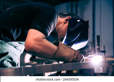 Worker Welding Aluminum Using Tig Welder