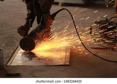 worker welding in workshop and welding