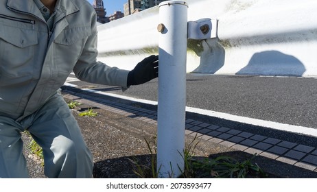 A worker who inspects the guardrail.