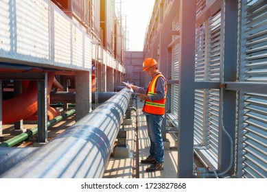 Worker  work on site construction. Senior engineer on construction site check workflow. construction,engineer,site,management,safety,civil,workers
