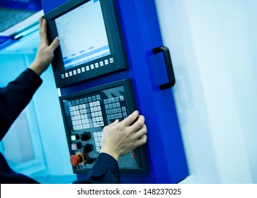 worker working with cnc machine at workshop. - Shutterstock ID 148237025