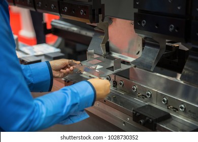 Worker working in factory in metal sheet bending process, this immage can use for factory, industrial, production and job concept