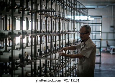 A Worker Working On Warp Knitting Machine In Denizli / Turkey, 23 August 2017