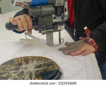                    Worker-cutting machine using machinery in a factory            