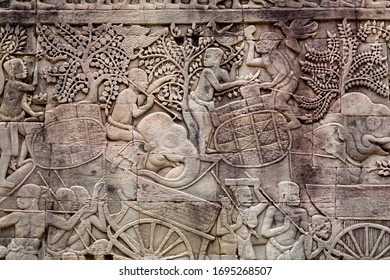 Workers Of Ancient Farms, Stone Relief From The 12th Century Bayon Temple, Cambodia. Historical Artwork On Wall Of Khmer Landmark In Angkor.