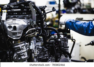 Workers Are Assembling Engines In Factories, Which Are At The Heart Of The Car. (Automotive Industry)