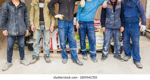 Workers and builders and foreman are as gang with dirty uniform are staying in apartment that is under construction, remodeling,renovation,extension, restoration, overhaul and reconstruction