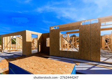 Workers are building new structure using wooden beams frames in build process
