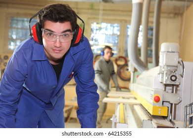 Workers in carpentry workshop
