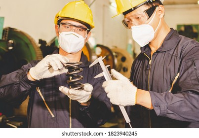 The workers are checking the quality size and design of the metal parts with Vernier Caliper from the metalwork in the factory. The manufacturing metal parts and the checking of quality.