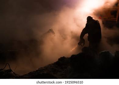 Workers Of The City Utility Service Fix An Accident On The Pipeline Of Heating Networks On A Frosty Winter Night