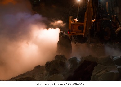 Workers Of The City Utility Service Fix An Accident On The Pipeline Of Heating Networks On A Frosty Winter Night