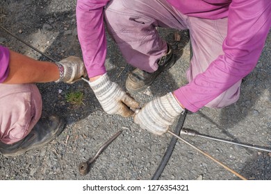 The Workers Clears The Clogged Sewer Drain Using Drain Clog Remover