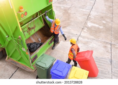 Workers collect garbage with Garbage collection truck,Garbage collection workers in residential area - Shutterstock ID 2013728828