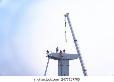 Workers constructing a bridge interchange ,Supporting elevated bridges Construction worker and crane, construction equipment at construction site.