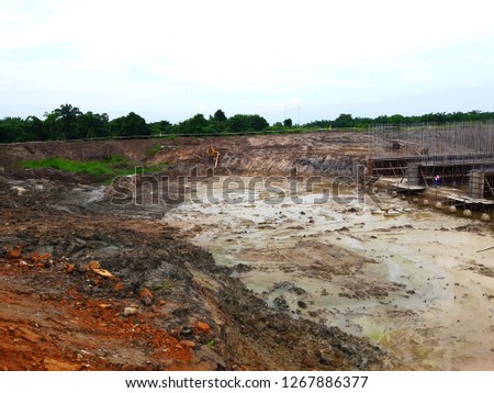 Workers are constructing dams to prevent flooding in the rainy season and keep water in the dry season.