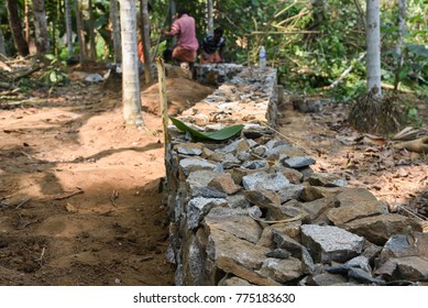 Workers At Construction Site Building Strong Foundation Or Base, Compound Wall For A House Or Villa Or Apartment,
 Kerala, India. 