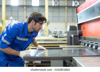 Workers cut sheet metal with modern cutting machines, Metallurgical industry factory. - Powered by Shutterstock