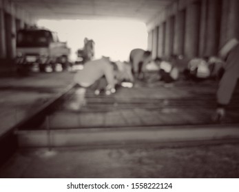 Workers doing road construction (blurred images)