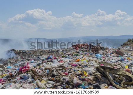 Workers in the dump. They sort out garbage for recycling. many foods and articles thrown. Urban Dumping grounds trash garbage