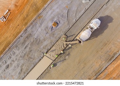 Workers During Construction Of Sidewalk Concrete Mix Truck Is Pouring Cement