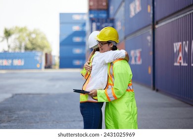 workers or engineers feeling happy from success work and hugging in containers warehouse storage - Powered by Shutterstock