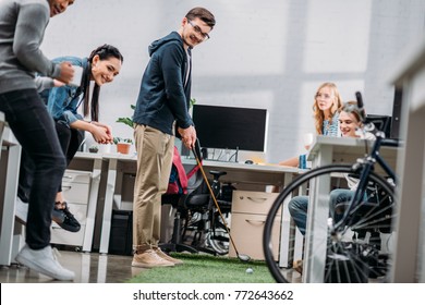 Workers Having Fun In Office, Man Playing Mini Golf