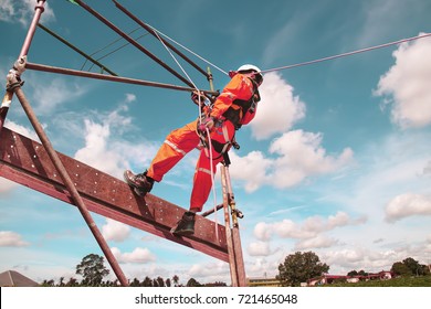 workers up high with safety equipment and safety belts, construction workers wearing safety harness belt high place on monotone. - Shutterstock ID 721465048