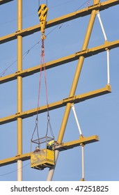 Workers In A Hoist Basket